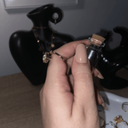 Elegant Alora pearl spinning ring being worn on a hand for calming focus.